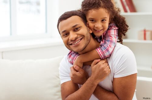 Daughter on her fathers back