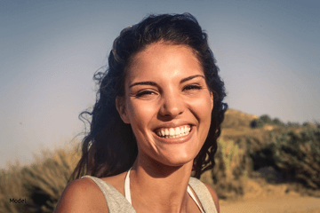 Woman with black hair smiling