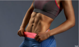 Woman with abs thanks to Emsculpt