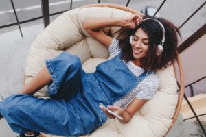 Woman sitting and listening to music